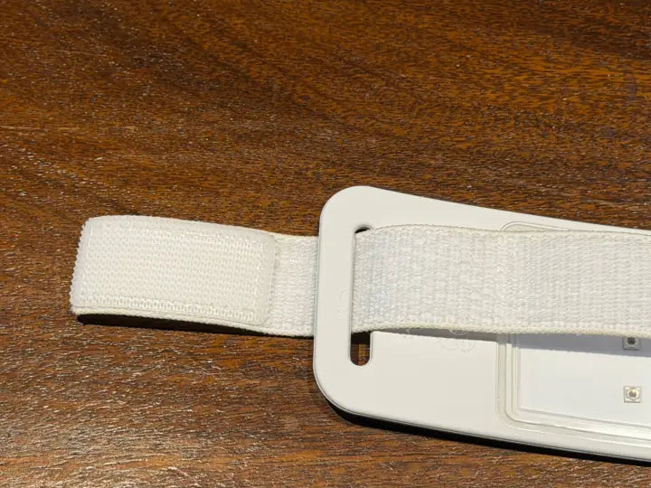 Strap end threaded through the slot at one end of the collar