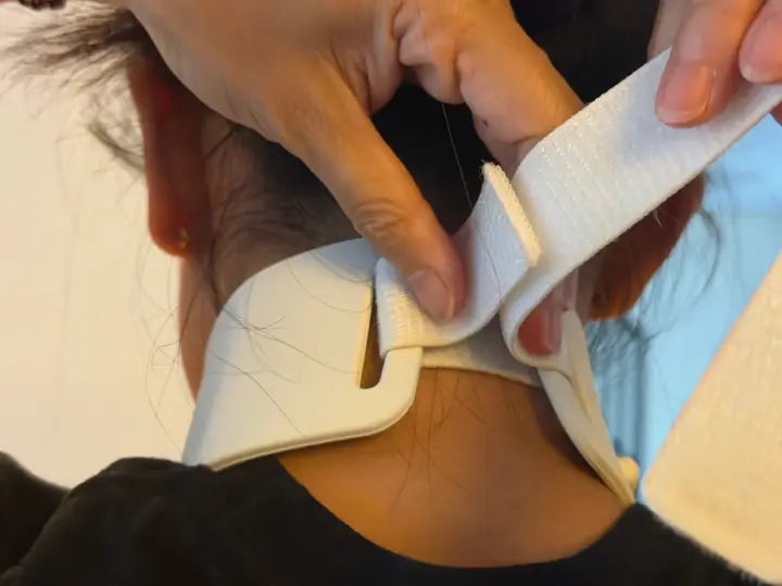 Strap pulled back to adjust the fit